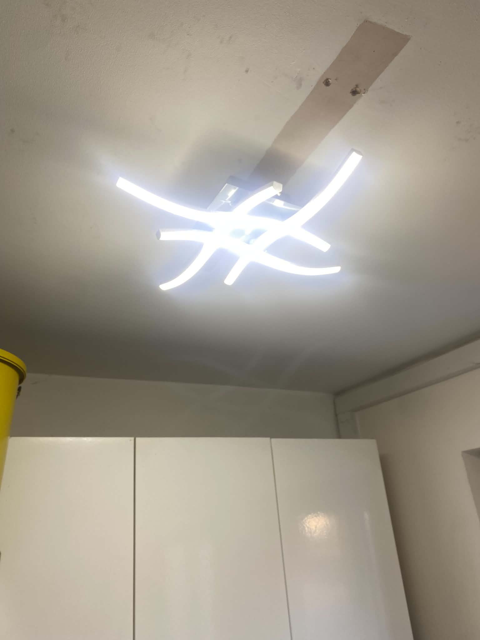 Modern white LED ceiling light fixture installation