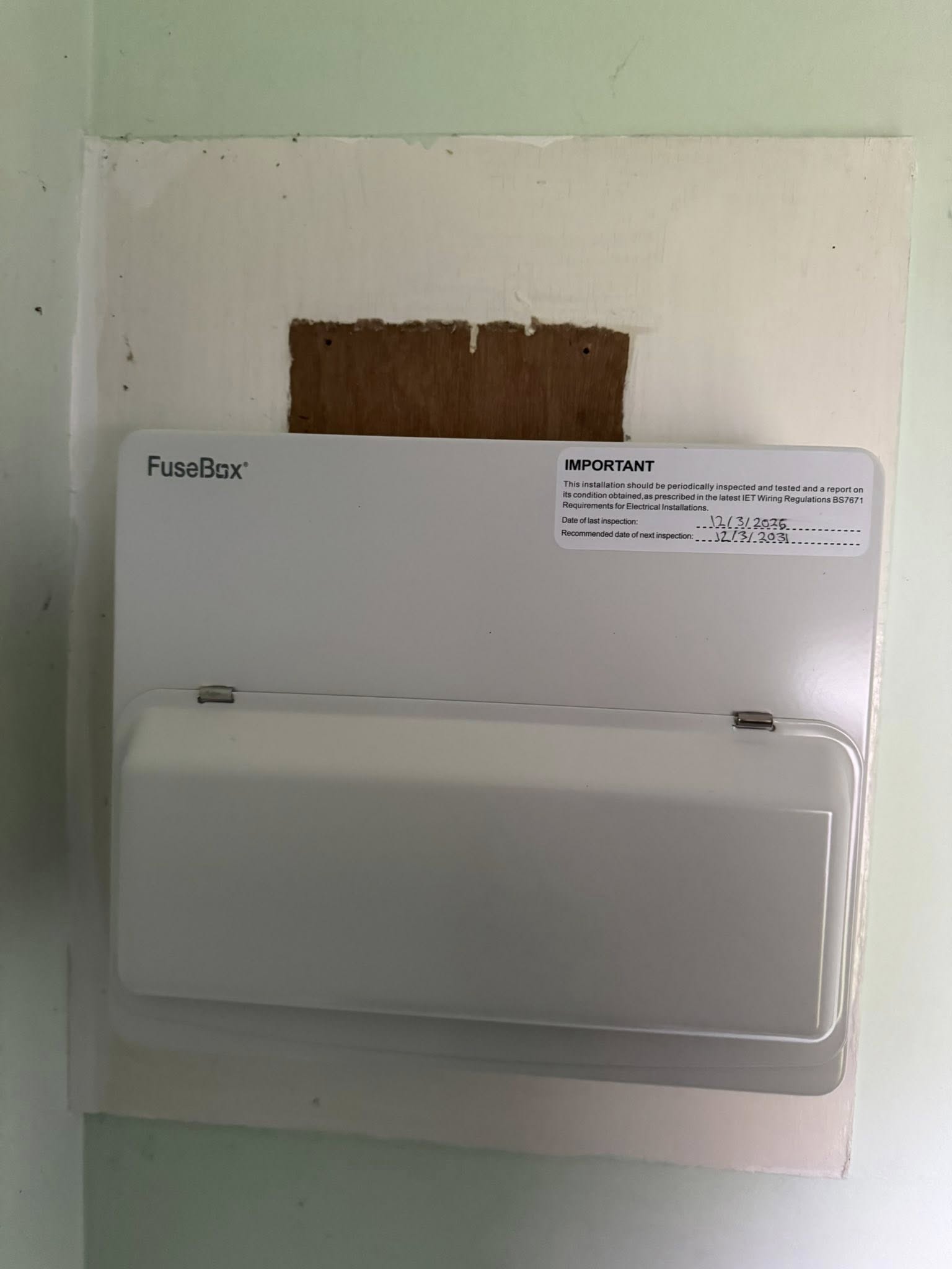 White FuseBox consumer unit with inspection label