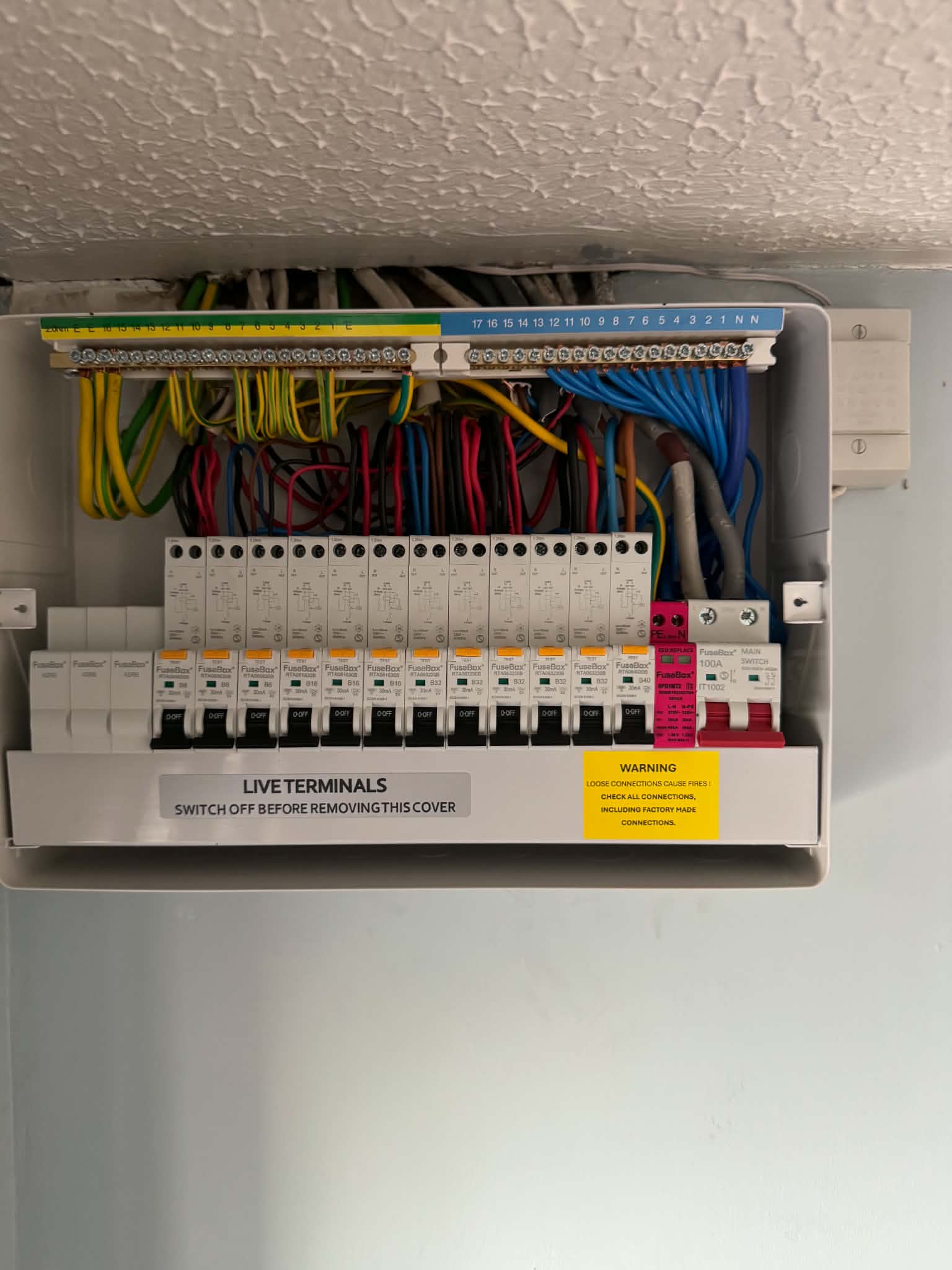 Open consumer unit with organized colored wiring installation
