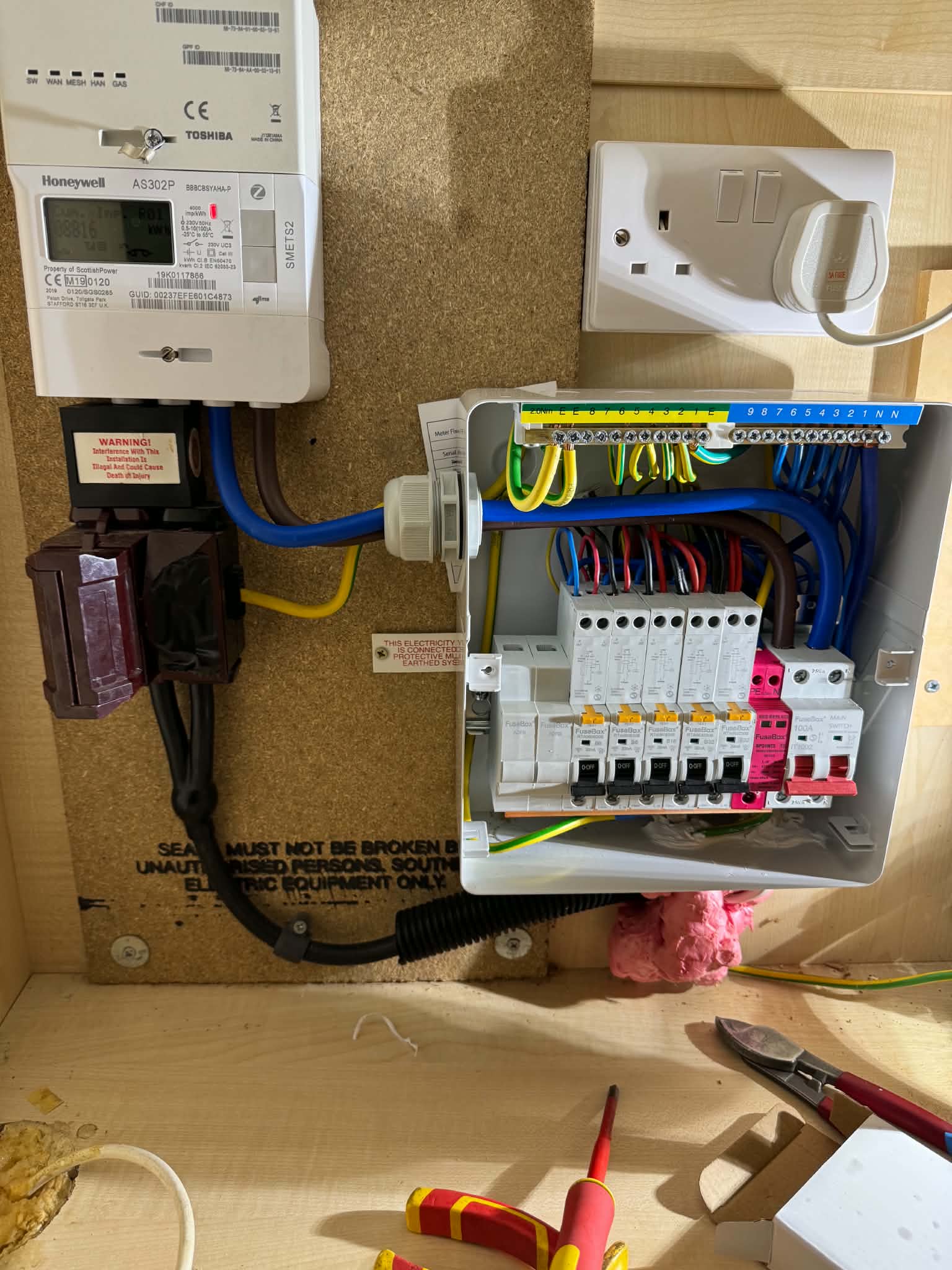 Open consumer unit with neat wiring and circuit breakers installation