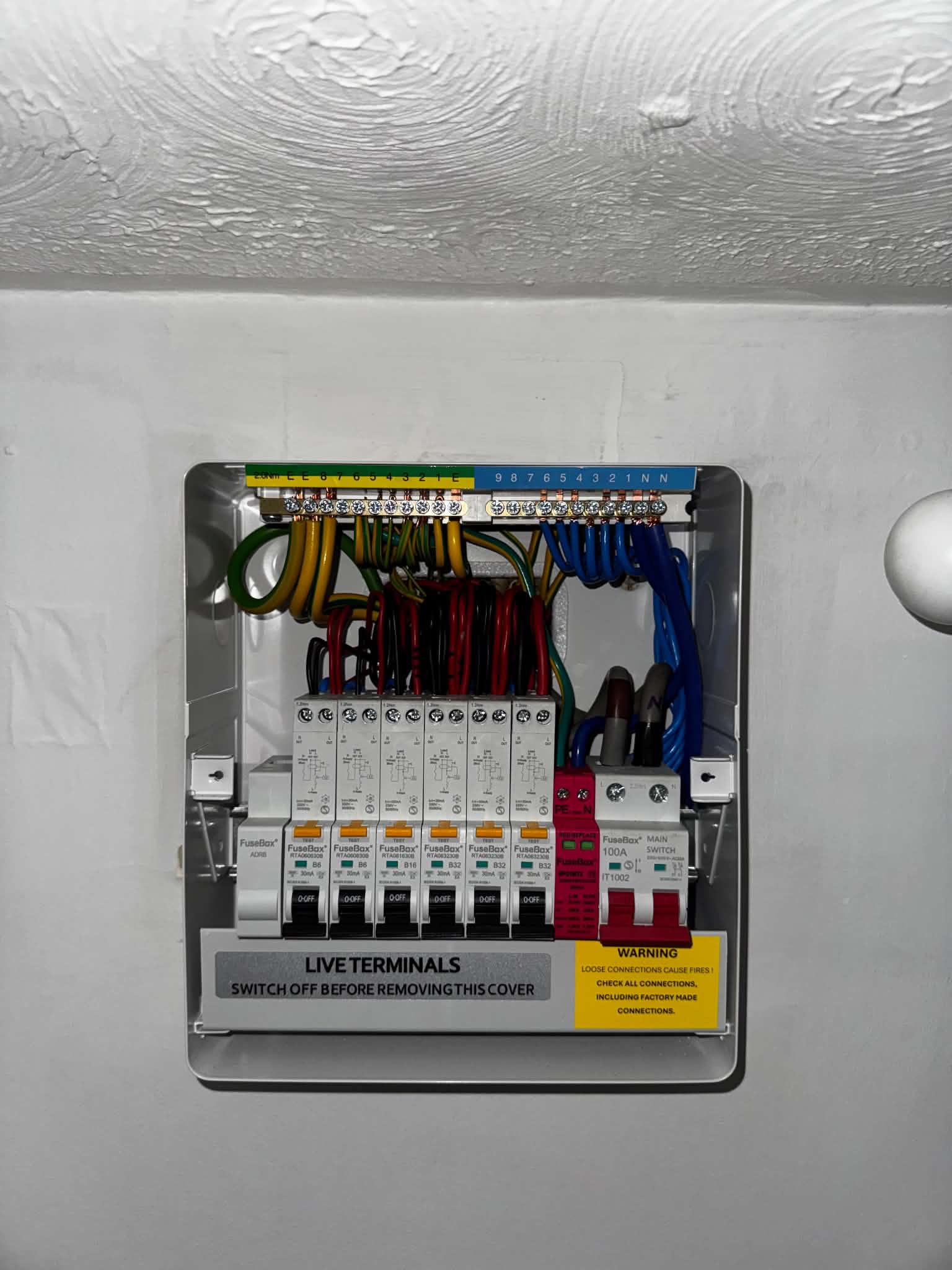 Open consumer unit with FuseBox components and wiring